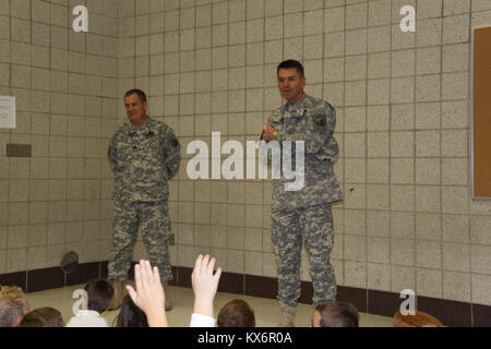 Major Gen. Jeff Burton and Command Sgt. Maj. Michael Miller thank the three kindergarten classes at St. John The Baptist Catholic Schools for their donation to the Utah Guard Charitable Trust. Stock Photo