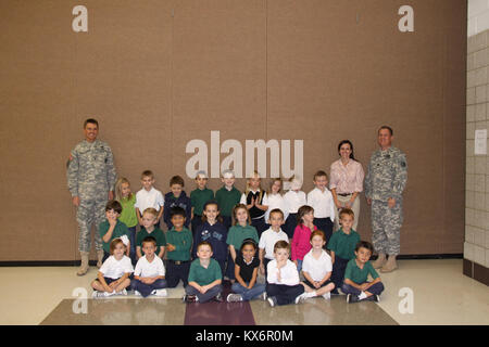 Major Gen. Jeff Burton and Command Sgt. Maj. Michael Miller thank the three kindergarten classes at St. John The Baptist Catholic Schools for their donation to the Utah Guard Charitable Trust. Stock Photo