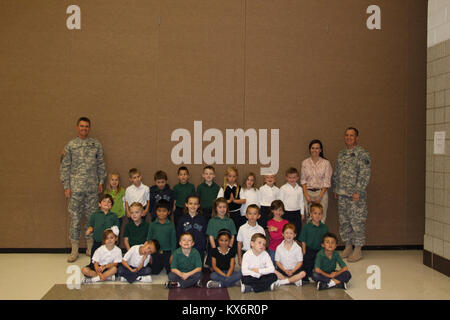 Major Gen. Jeff Burton and Command Sgt. Maj. Michael Miller thank the three kindergarten classes at St. John The Baptist Catholic Schools for their donation to the Utah Guard Charitable Trust. Stock Photo