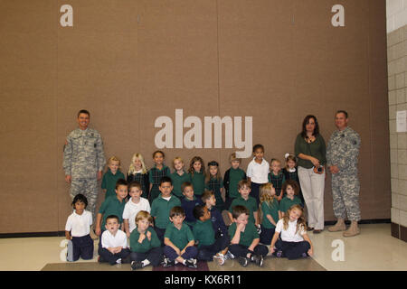 Major Gen. Jeff Burton and Command Sgt. Maj. Michael Miller thank the three kindergarten classes at St. John The Baptist Catholic Schools for their donation to the Utah Guard Charitable Trust. Stock Photo