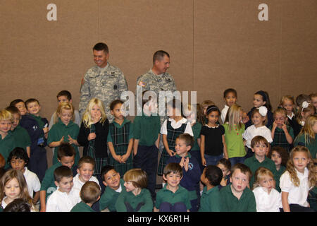 Major Gen. Jeff Burton and Command Sgt. Maj. Michael Miller thank the three kindergarten classes at St. John The Baptist Catholic Schools for their donation to the Utah Guard Charitable Trust. Stock Photo