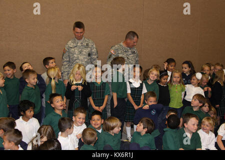 Major Gen. Jeff Burton and Command Sgt. Maj. Michael Miller thank the three kindergarten classes at St. John The Baptist Catholic Schools for their donation to the Utah Guard Charitable Trust. Stock Photo