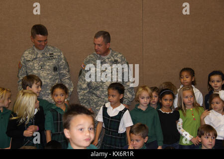 Major Gen. Jeff Burton and Command Sgt. Maj. Michael Miller thank the three kindergarten classes at St. John The Baptist Catholic Schools for their donation to the Utah Guard Charitable Trust. Stock Photo