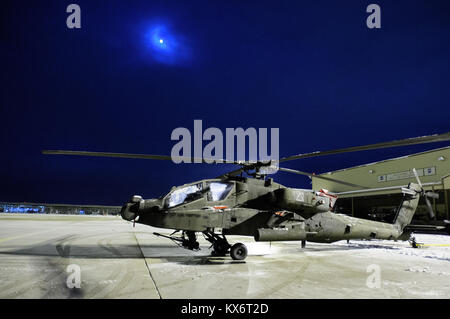An AH-64D Apache Longbow, 1-211 Aviation Brigade from West Jordan, Utah, waits to receive maintenance after being removed from a C-17 Globemaster III Dec. 28, 2012, Hill Air Force Base, Utah. The Apache returned home after spending 9 months in Afghanistan. (U.S. Air Force photo by Staff Sgt. Staci Miller/RELEASED) Stock Photo