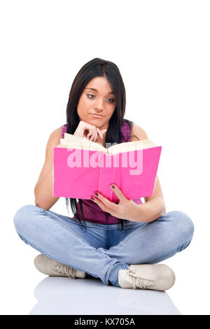 portrait of a girl teenager reading book, isolated over white background Stock Photo