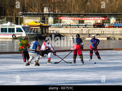 Beijing, Beijing, China. 7th Jan, 2018. Beijing, CHINA-7th January 2018:(EDITORIAL USE ONLY. CHINA OUT) People play hockey on frozen lake in Beijing, January 7th, 2018. Credit: SIPA Asia/ZUMA Wire/Alamy Live News Stock Photo
