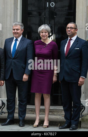 London, UK. 8th Jan, 2018. Prime Minister Theresa May stands outside 10 Downing Street with the new Conservative Party Chairman Brandon Lewis (to her left) and Deputy Chairman James Cleverly (to her right) following a Cabinet reshuffle. Credit: Mark Kerrison/Alamy Live News Stock Photo
