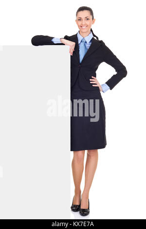 beautiful business woman leaning on billboard, isolated over white background,  full length Stock Photo