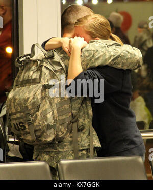 Photos by:  Lt. Col. Hank McIntire   DRAPER, Utah — Approximately 60 soldiers of the Utah Army National Guard’s 2nd Battalion, 211th Aviation, departed Utah on the first leg of their 12-month deployment to Kosovo Saturday, Nov. 23 and Sunday, 24, 2013.   The first group of soldiers departed via UH-60 Blackhawk helicopters Saturday, Nov. 23, at 10 a.m. from the Utah Guard’s Army Aviation Support Facility in West Jordan.  Remaining soldiers departed Sunday, Nov. 24, from Salt Lake International Airport via commercial aircraft.   Soldiers will first travel to Fort Hood, Texas, for several weeks o Stock Photo