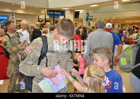 Eighteen members of the 65th Field Artillery Brigade returned from a 12-month deployment to Afghanistan where they served as Security Forces Advise and Assist Team members. Stock Photo