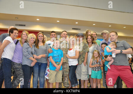 Eighteen members of the 65th Field Artillery Brigade returned from a 12-month deployment to Afghanistan where they served as Security Forces Advise and Assist Team members. Stock Photo