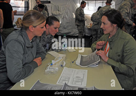 Members of the Colorado National Guard Chemical, Biological, Radiological, Nuclear (CBRN) Enhanced Response Force Package (CERFP) train with medical personnel from Primary Children's Hospital in Salt Lake City, Utah on November 5, 2014 during Vigilant Guard. The Guardsmen had the opportunity to train with the hospital staff on procedures for pediatric patients. (Air National Guard photo by Staff Sgt. Annie Edwards/RELEASED) Stock Photo