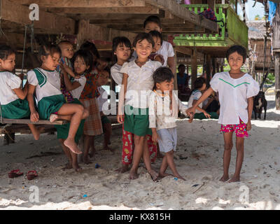 School girls at a Moken sea gypsy village at Dome Island outside Myeik, a part of the Mergui or Myeik Archipelago in the Tanintharyi Region of Souther Stock Photo