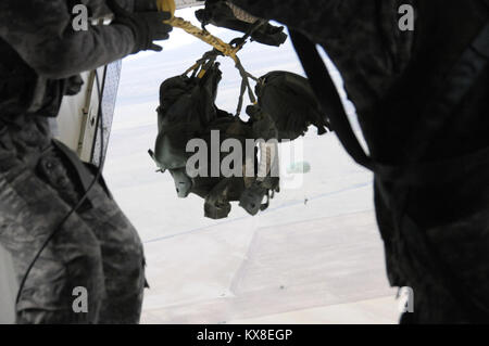 US army paratroopers jumping from plane. Stock Photo