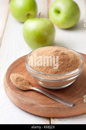 crushed apple fiber, green apple on a light  background. dietary product Stock Photo