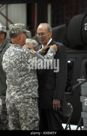 Richard Johnson, a World War II veteran who served in the European Theater of Operations as an infantry machine gunner, officially recieved the Bronze Star Medal he earned during WWII in a ceremony at the E. J. Garn Aviation Complex in West Jordan Nov. 19, 2010. Stock Photo