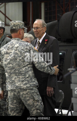 Richard Johnson, a World War II veteran who served in the European Theater of Operations as an infantry machine gunner, officially recieved the Bronze Star Medal he earned during WWII in a ceremony at the E. J. Garn Aviation Complex in West Jordan Nov. 19, 2010. Stock Photo