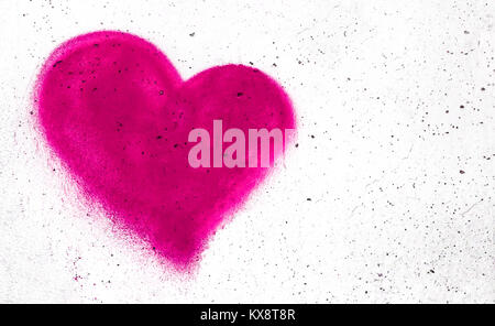 Pink heart shaped on grungy wall background with copy space Stock Photo