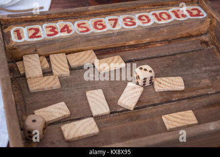 Antique Table Game with Dices and Rectangular Wooden Pieces on Board. Stock Photo
