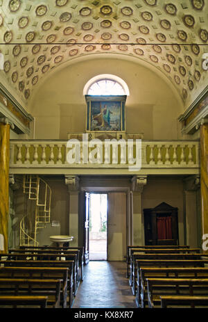 exit of the church with open part and organ with painted wooden covering above Stock Photo