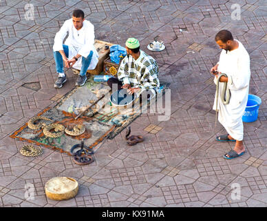 Snake charmers on the Djemaa el Fna market square in Marrakesh, Morocco Stock Photo