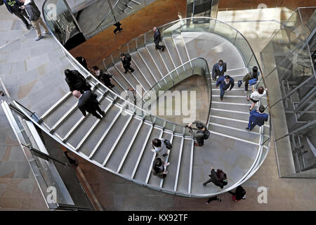 Overhead view looking down on people walking on stairway staircase inside the shopping centre at One New Change in Central London UK.  KATHY DEWITT Stock Photo