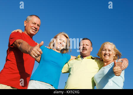 Elderly people showing thumbs up. Stock Photo