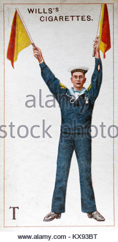 Marine using Semaphore to signal  the letter T Stock Photo