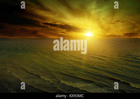 Dawn in the sea. Dramatic clouds at dusk. Stock Photo