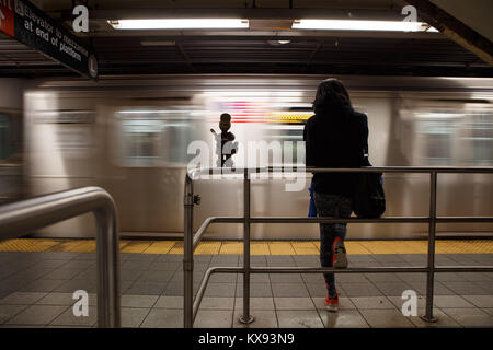 'Life Underground' is a permanent public artwork created by sculptor Otterness for the 14th Street – Eighth Avenue station of NY subway Stock Photo