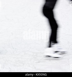 Arty blurry teenage girl ice skating legs , fun and winter recreation detail Stock Photo