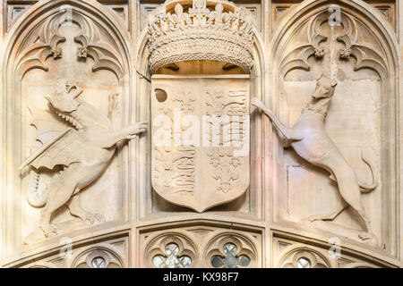 Royal insignia carved in stone on a wall of the ante-chapel of the chapel at King's college, Cambridge university, England. Stock Photo