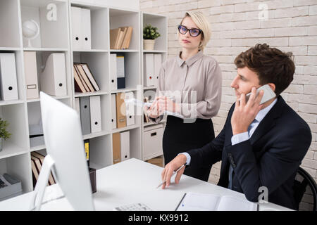Business Executives Busy Working in Office Stock Photo