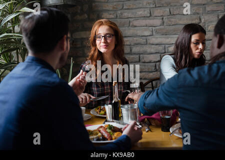 Attractive man and cute woman having meal