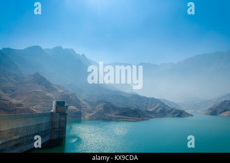 Foggy and moody landscape of a lake and dam. Muscat, Oman. Stock Photo