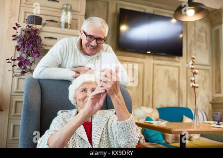 Taking Selfie with Senior Husband Stock Photo