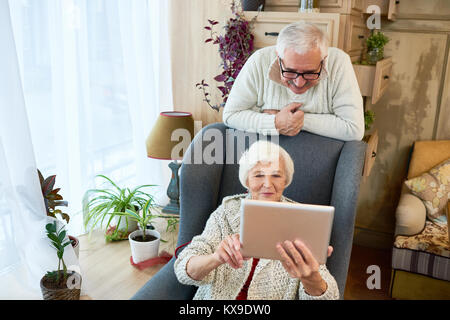 Senior Woman Using Digital Tablet Stock Photo