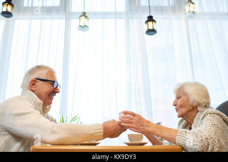 Exchanging Christmas Presents Stock Photo