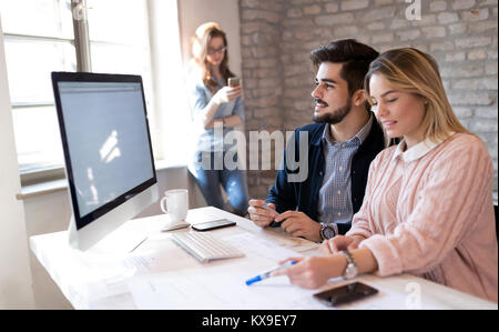 Coworking process, designers team working in modern office Stock Photo
