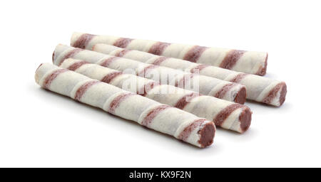 Waffle tubes with chocolate cream on white background Stock Photo