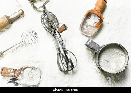 Various baking tools on flour. Top view Stock Photo