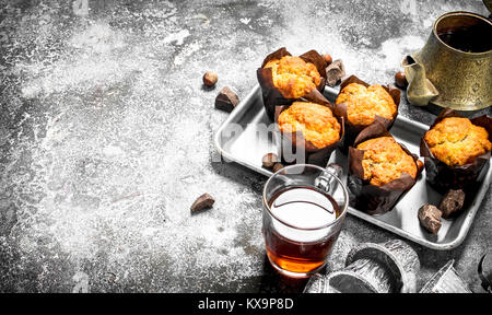 Honey muffins with fragrant tea. On a rustic background. Stock Photo