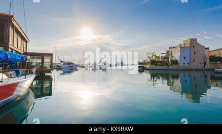 Beautiful Marina in Limassol city Cyprus. Modern, new port with docked yachts, restaurants, shops, a landmark.View of the residential area at sunrise, Stock Photo