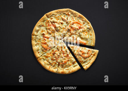 Pizza with chicken cheese and tomato on a black stone background Stock Photo