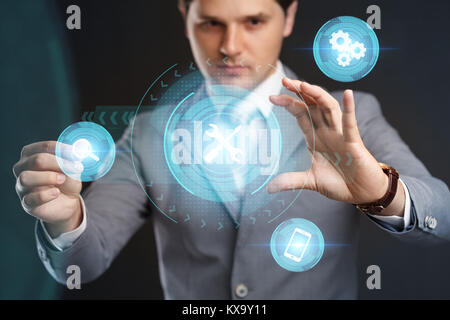 Business Technology. Internet Concept. Technical Support Customer Service. Businessman pressing button on virtual screens Stock Photo