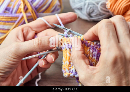 Young Woman Knitting - Knitting inspiration is at your fingertips Stock Photo