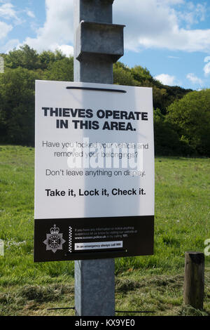 Thieves operate in this area sign at Stoughton car park, West Sussex Stock Photo