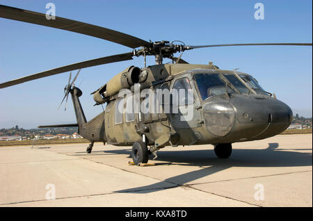 Combat chopper sitting on the tarmac Stock Photo