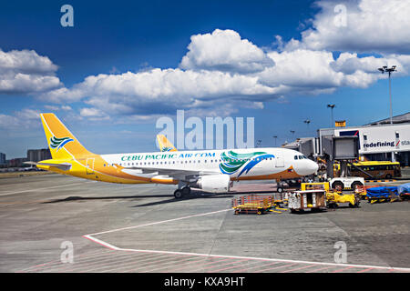 MANILA, PHILIPPINES - FEBRUARY 24: Cebu Pacific airpane in Manila airport on February, 24, 2013, Manila, Philippines. Its airline based on the grounds Stock Photo