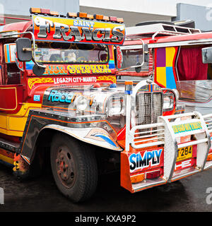 MANILA, PHILIPPINES - FEBRUARY 25: Jeepney on the bus station on February, 25, 2013, Manila, Philippines. Jeepney is a most popular public transport o Stock Photo